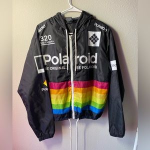 large in kids. Black Polaroid windbreaker.